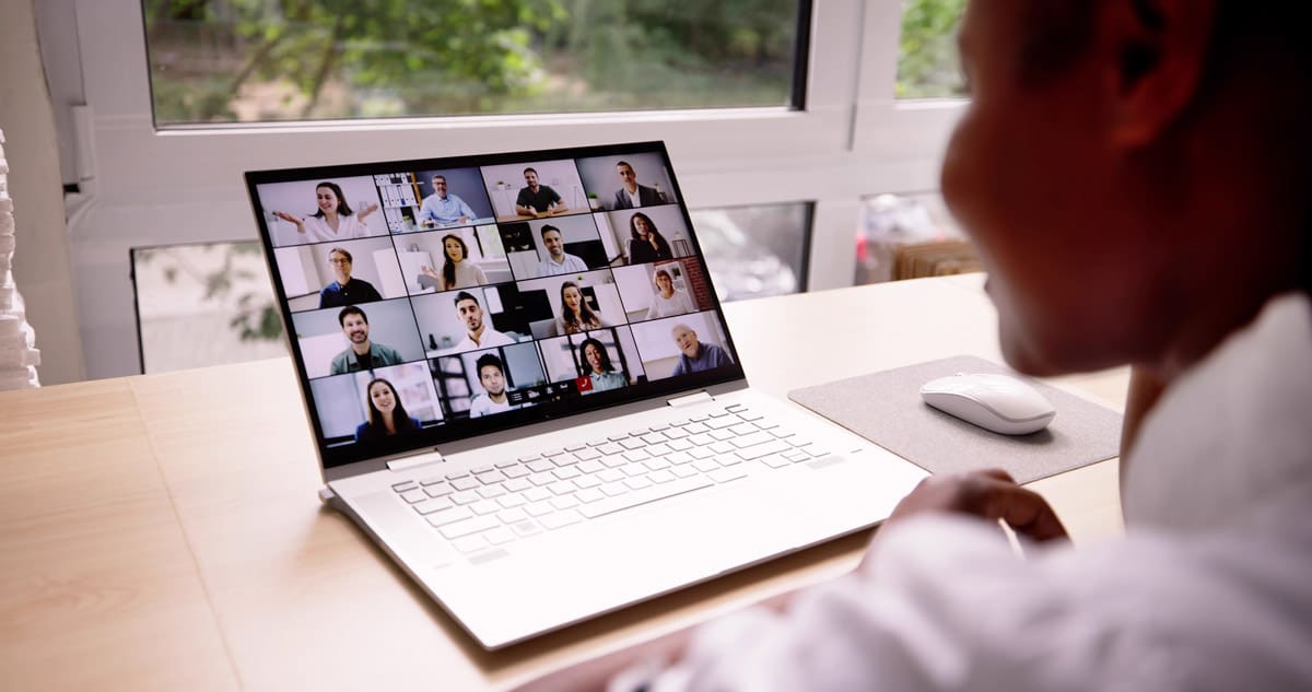 multi-person zoom meeting on a laptop screen